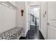 Entryway with a bench, hooks for storage, and a view of the staircase at 502 Abbington River Ln, Atlanta, GA 30339