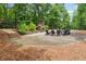 A stone fire pit area with seating, ideal for relaxing and socializing outdoors at 502 Abbington River Ln, Atlanta, GA 30339