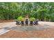 Picturesque outdoor fire pit with seating surrounded by trees, perfect for gatherings at 502 Abbington River Ln, Atlanta, GA 30339