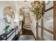 Inviting foyer with hardwood floors, stairs, and elegant decor at 502 Abbington River Ln, Atlanta, GA 30339