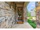 Charming entryway featuring a stone facade and decorative wreath at 502 Abbington River Ln, Atlanta, GA 30339