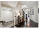 Hallway featuring a skylight, hardwood flooring, and dark wood banisters at 502 Abbington River Ln, Atlanta, GA 30339