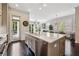 Spacious kitchen with stainless steel appliances, an island, and a door to the outdoor area at 502 Abbington River Ln, Atlanta, GA 30339