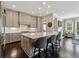 Beautiful kitchen featuring grey cabinets, a large center island with seating, and hardwood floors at 502 Abbington River Ln, Atlanta, GA 30339