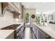 Gourmet kitchen boasts marble countertops, stainless steel appliances, and access to an outdoor deck at 502 Abbington River Ln, Atlanta, GA 30339