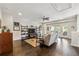 Open-concept living room with a large TV, shelving, and access to a covered outdoor balcony at 502 Abbington River Ln, Atlanta, GA 30339