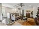 Elegant living room with a gray sofa, wet bar, and dark hardwood floors at 502 Abbington River Ln, Atlanta, GA 30339