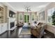 Cozy living room featuring a fireplace and natural light from windows at 502 Abbington River Ln, Atlanta, GA 30339