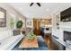 Open living space flowing into the kitchen with fireplace feature at 502 Abbington River Ln, Atlanta, GA 30339