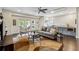Inviting living room with a comfortable couch, elegant round table, and access to the outdoor patio at 502 Abbington River Ln, Atlanta, GA 30339