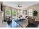 Inviting living room with fireplace, built-in cabinets, and natural light at 502 Abbington River Ln, Atlanta, GA 30339