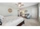 Serene main bedroom with neutral colors, carpet, and a stylish sitting area at 502 Abbington River Ln, Atlanta, GA 30339