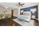 Spacious main bedroom with sitting area, accent wall, and large windows at 502 Abbington River Ln, Atlanta, GA 30339
