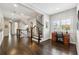 Bright office space with dark hardwood floors, a large window with shutter blinds, and a built-in desk with wooden drawers at 502 Abbington River Ln, Atlanta, GA 30339