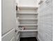 Walk-in pantry with lots of shelving and storage space to keep your kitchen organized at 502 Abbington River Ln, Atlanta, GA 30339