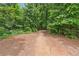 Scenic community path winding through lush trees and greenery for outdoor enjoyment at 502 Abbington River Ln, Atlanta, GA 30339