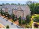 Charming townhomes featuring brick facades, manicured landscaping, and inviting curb appeal at 502 Abbington River Ln, Atlanta, GA 30339