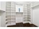 Custom walk-in closet with shelving and hanging space at 502 Abbington River Ln, Atlanta, GA 30339