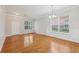 Dining area with hardwood floors, classic wainscoting, a glass door, and bright natural light at 5937 Sharp Se Dr, Mableton, GA 30126