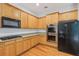 A well-equipped kitchen featuring wooden cabinets, stainless steel appliances, and granite countertops at 5937 Sharp Se Dr, Mableton, GA 30126