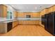 A well-lit kitchen featuring wood cabinets, stainless steel appliances, and granite countertops at 5937 Sharp Se Dr, Mableton, GA 30126