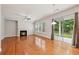 Bright living room with a modern fireplace, hardwood floors, large sliding glass doors to backyard at 5937 Sharp Se Dr, Mableton, GA 30126