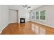 Bright living room with a modern fireplace, hardwood floors, and large windows at 5937 Sharp Se Dr, Mableton, GA 30126