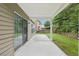 Covered patio showing sliding glass doors to house and view of backyard at 5937 Sharp Se Dr, Mableton, GA 30126