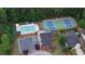 Aerial view showcasing the community pool, tennis courts, and clubhouse at 964 Village View Cir, Loganville, GA 30052