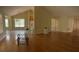 Open-concept living room features hardwood floors, vaulted ceilings, and natural light at 964 Village View Cir, Loganville, GA 30052