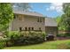 Well-maintained backyard featuring a deck, fire pit, and lush lawn, great for outdoor activities at 1369 Willowbrook Sw Dr, Marietta, GA 30064