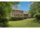 Expansive backyard with lush green grass and privacy provided by mature trees and landscaping at 1369 Willowbrook Sw Dr, Marietta, GA 30064