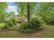 Scenic backyard featuring mature trees and landscaping, creating a peaceful and natural retreat at 1369 Willowbrook Sw Dr, Marietta, GA 30064