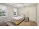 Cozy bedroom featuring natural light, neutral walls and an accent bench, creating a tranquil retreat at 1369 Willowbrook Sw Dr, Marietta, GA 30064