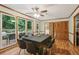 Open dining area with hardwood floors, a dining table, and large windows offering serene outdoor views at 1369 Willowbrook Sw Dr, Marietta, GA 30064