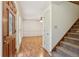 Inviting foyer with hardwood floors, staircase, and a view into the living room, enhanced by natural light at 1369 Willowbrook Sw Dr, Marietta, GA 30064