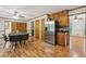 Eat-in kitchen area with stainless steel refrigerator, wooden cabinets, and a table that seats six at 1369 Willowbrook Sw Dr, Marietta, GA 30064