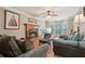 Cozy living room featuring a fireplace, hardwood floors, comfortable seating, and a bay window for natural light at 1369 Willowbrook Sw Dr, Marietta, GA 30064