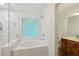 Bright main bathroom featuring a soaking tub and glass-enclosed shower at 1369 Willowbrook Sw Dr, Marietta, GA 30064