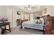 Well-lit main bedroom featuring a trey ceiling, large bed, and tv at 1369 Willowbrook Sw Dr, Marietta, GA 30064