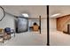 Finished basement area, including lighting, supporting columns and some vintage wooden furniture at 262 Somerset Ct, Lawrenceville, GA 30044