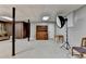 Basement featuring wood paneling, accent furniture, and storage, illuminated by overhead lighting at 262 Somerset Ct, Lawrenceville, GA 30044