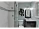 Modern bathroom with sleek vanity, tiled shower, and decorative shelving at 262 Somerset Ct, Lawrenceville, GA 30044