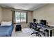 Bedroom featuring a desk, an amplifier, and large window at 262 Somerset Ct, Lawrenceville, GA 30044