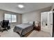 Cozy bedroom with a bed and a view into the hallway showing stairs to another level at 262 Somerset Ct, Lawrenceville, GA 30044