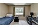 Bedroom featuring a desk, an amplifier, and large window at 262 Somerset Ct, Lawrenceville, GA 30044