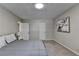 Serene bedroom with neutral tones, a comfortable bed, and artwork displayed on the wall at 262 Somerset Ct, Lawrenceville, GA 30044