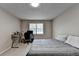 Functional bedroom with a comfortable bed and workspace illuminated by a window at 262 Somerset Ct, Lawrenceville, GA 30044
