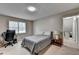 Comfortable bedroom featuring a bed, desk, and bright window providing natural light at 262 Somerset Ct, Lawrenceville, GA 30044