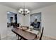 Formal dining room features decorative lighting with views to living spaces throughout the home at 262 Somerset Ct, Lawrenceville, GA 30044